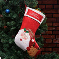 American style non-woven fabric Christmas stocking bag in elk, old man, or snowman design.