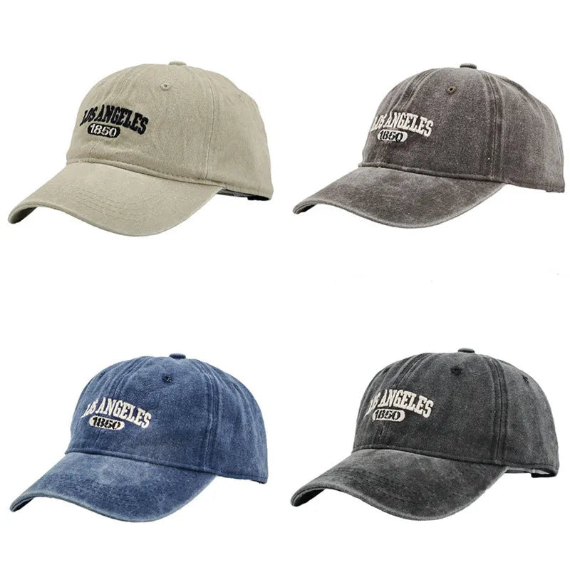 Retro distressed baseball cap with embroidered letters on the front, shown in a beige colour.