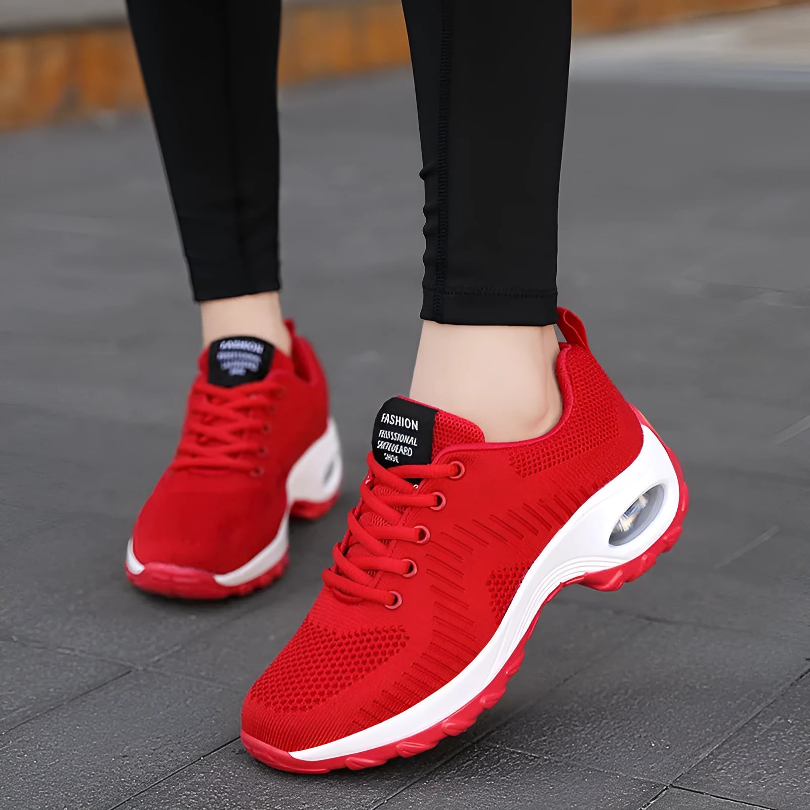 Red and black women's low-top lace-up mesh sneakers with a round toe and mid heel on a PU sole.
