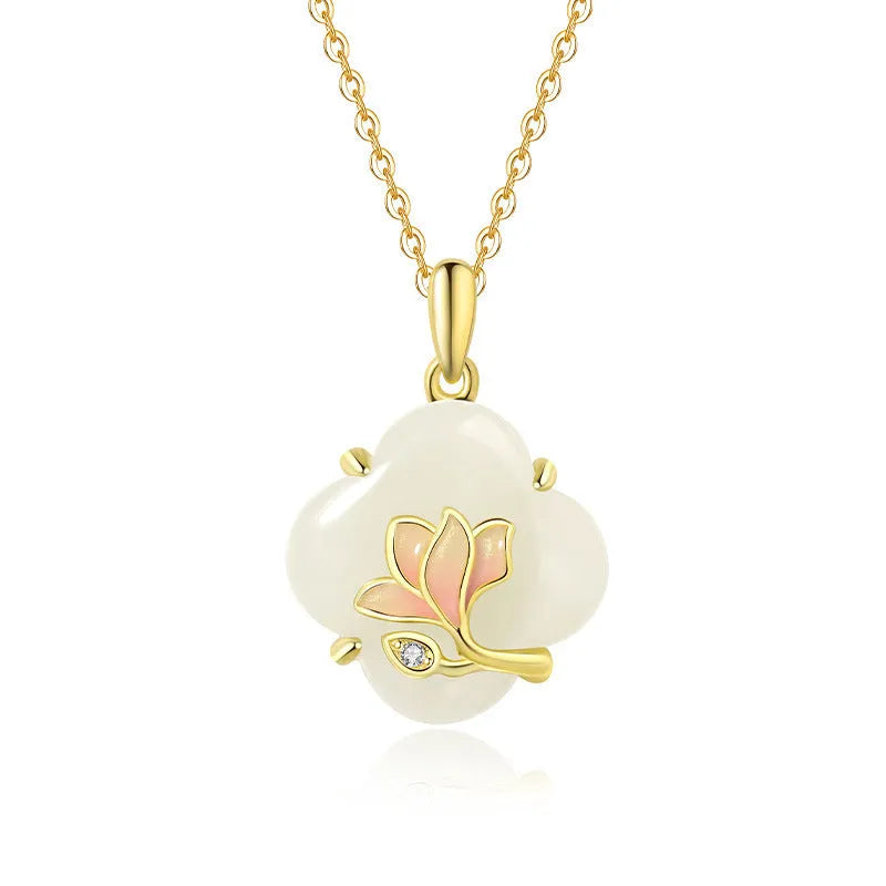 Magnolia flower jewellery set in sterling silver with inlaid green jade, showing necklace, bracelet, and stud earrings.