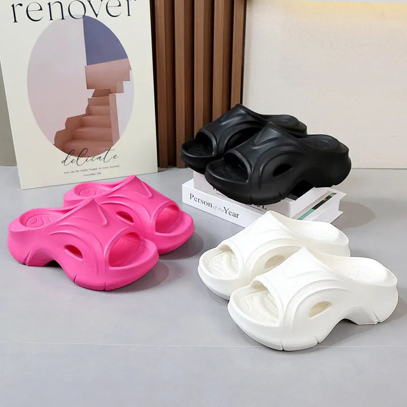 Women's white thick-soled EVA slippers with round toe for beach wear.