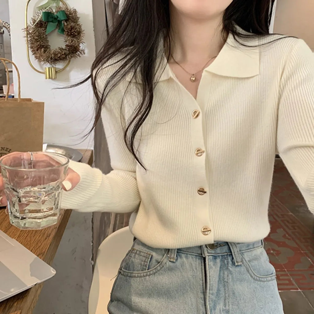 Long-sleeved loose-fitting viscose cardigan top in beige, shown worn open over a top