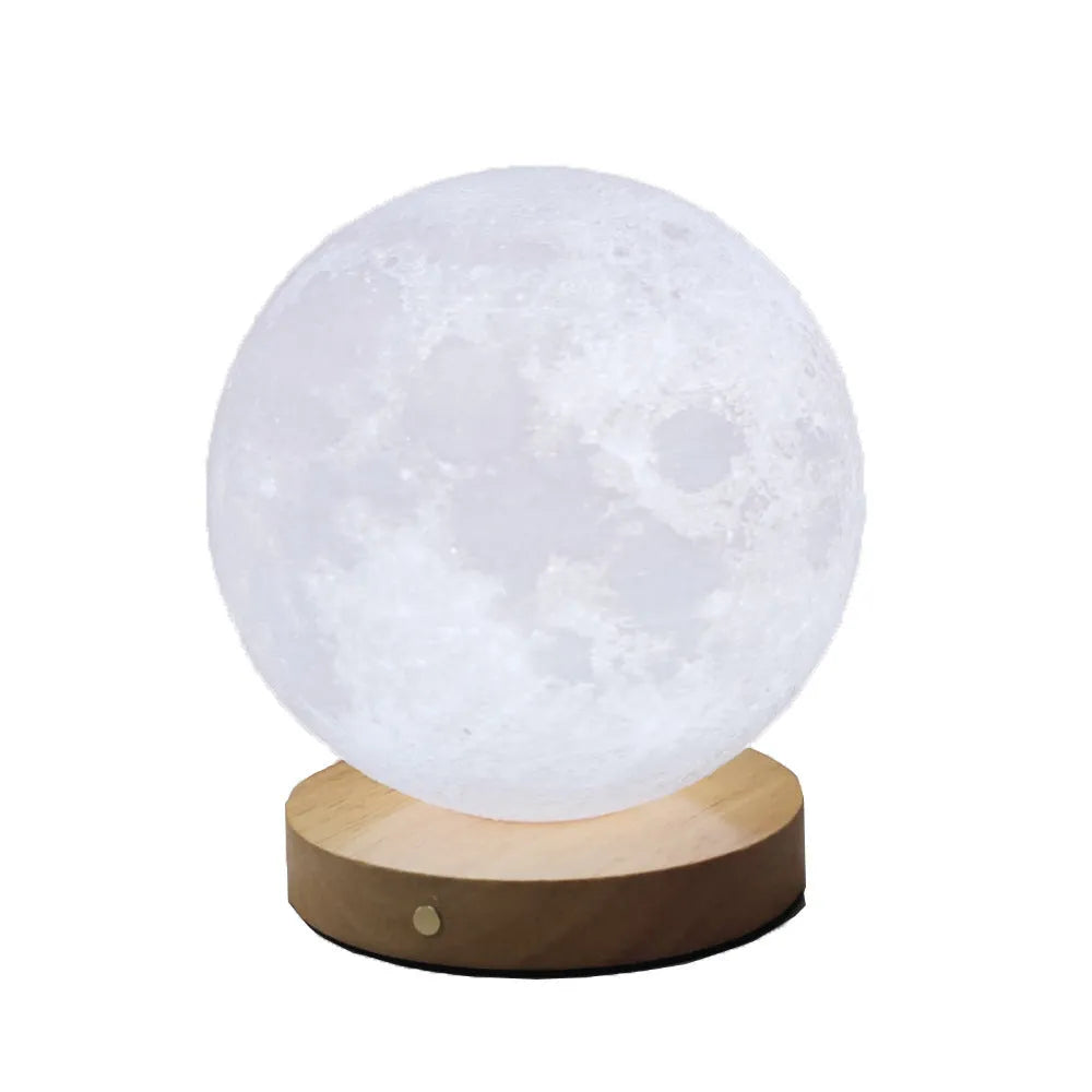 Rotating moon night lamp with wooden base showing three colour modes