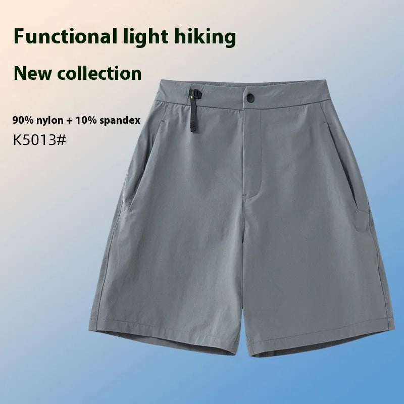 Man wearing army green quick-dry sports shorts with an elastic waistband for running or climbing.