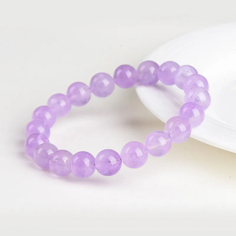 Lavender amethyst crystal bracelet with water ripple design and round beads in light purple colour