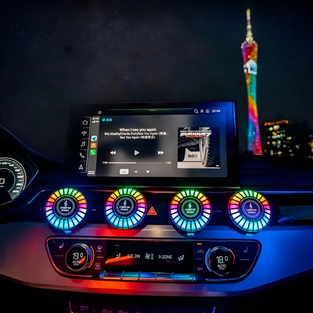 Car air vent mounted RGB atmosphere light with voice control and aromatherapy pod.