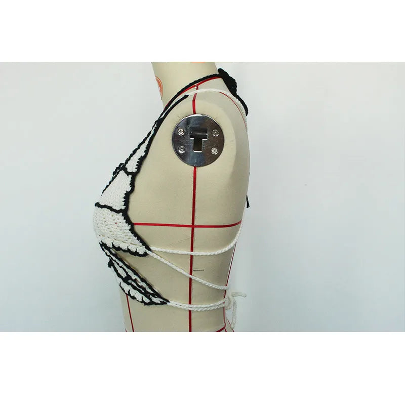 Women's black and white classic bikini swimsuit made from acrylic fabric.