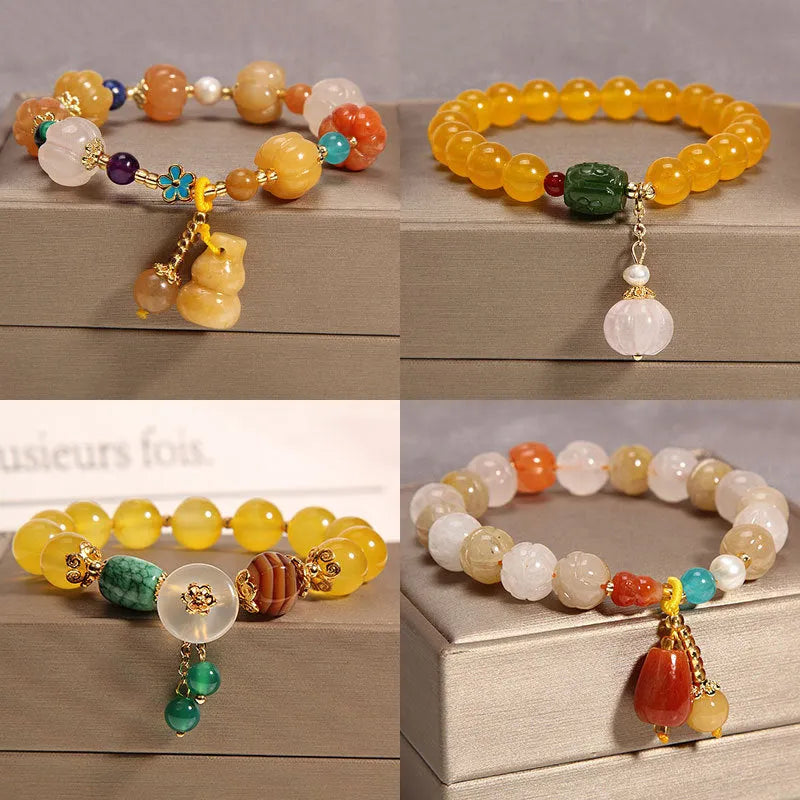 Women's adjustable crystal bracelet with yellow agate stones and gold silk thread.