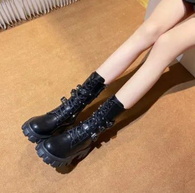 Women's black mid-calf boots with round toe, side zip, and adjustable metal buckle strap.