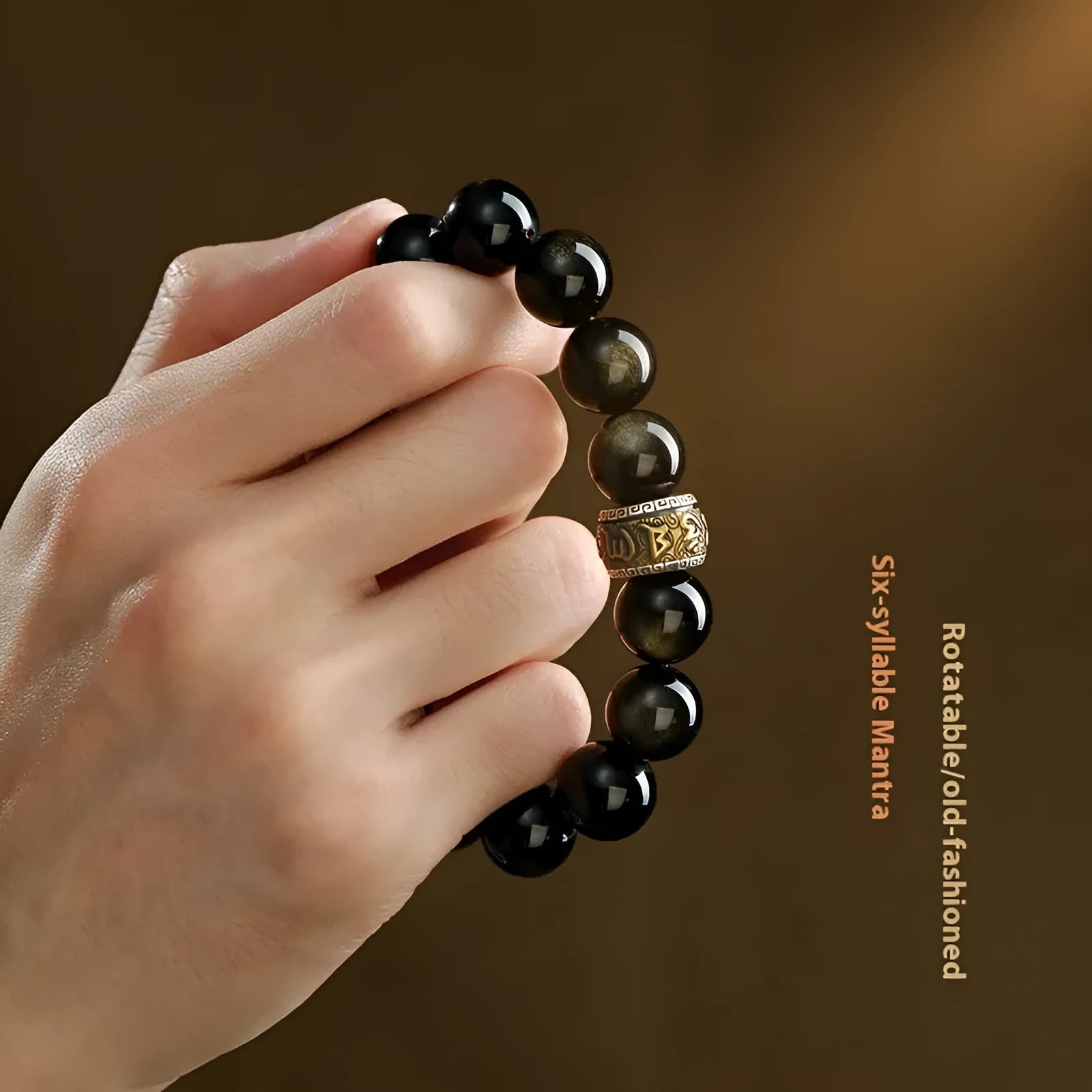 Carved cinnabar beads bracelet with gold obsidian animal zodiac design on a gift box.