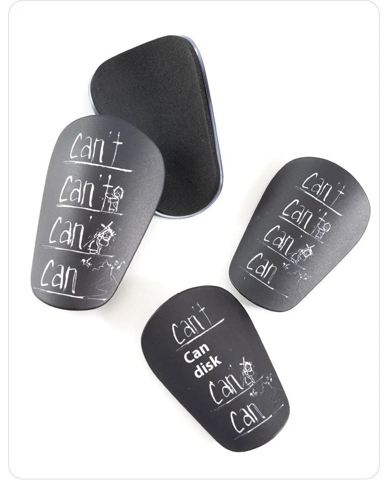 A pair of white and black PU football shin guards for S and XS sizes.