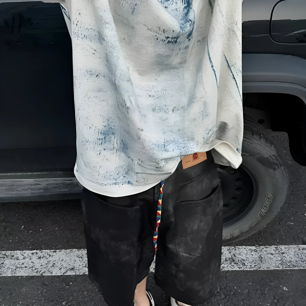 Dirty print pattern on a solid colour loose fit Korean style short sleeve t-shirt.