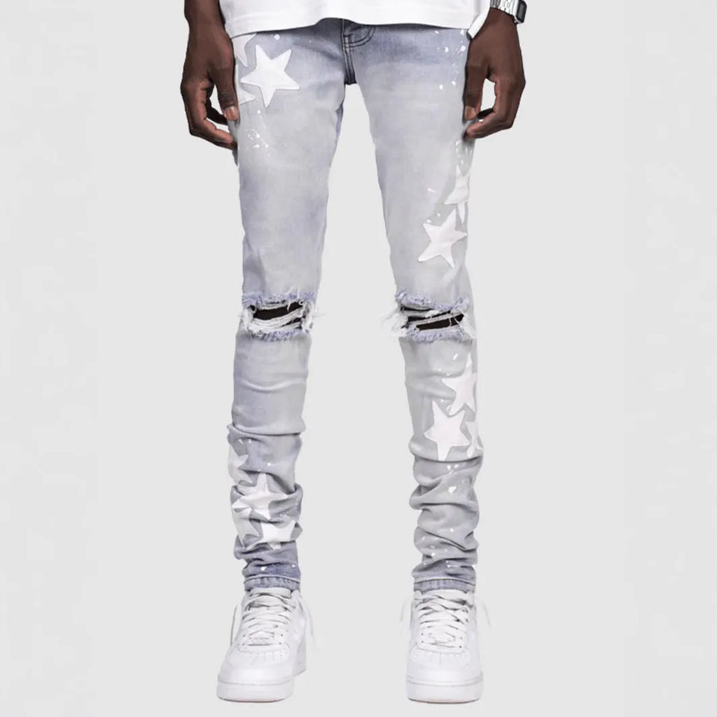 Men's slim fit stretch jeans in blue with mid waist and subtle embroidery detail on denim.