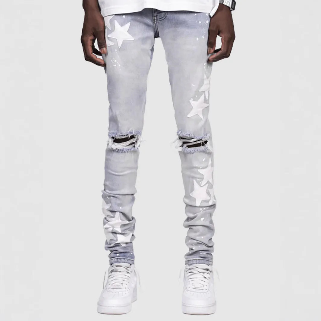Men's slim fit stretch jeans in blue with mid waist and subtle embroidery detail on denim.