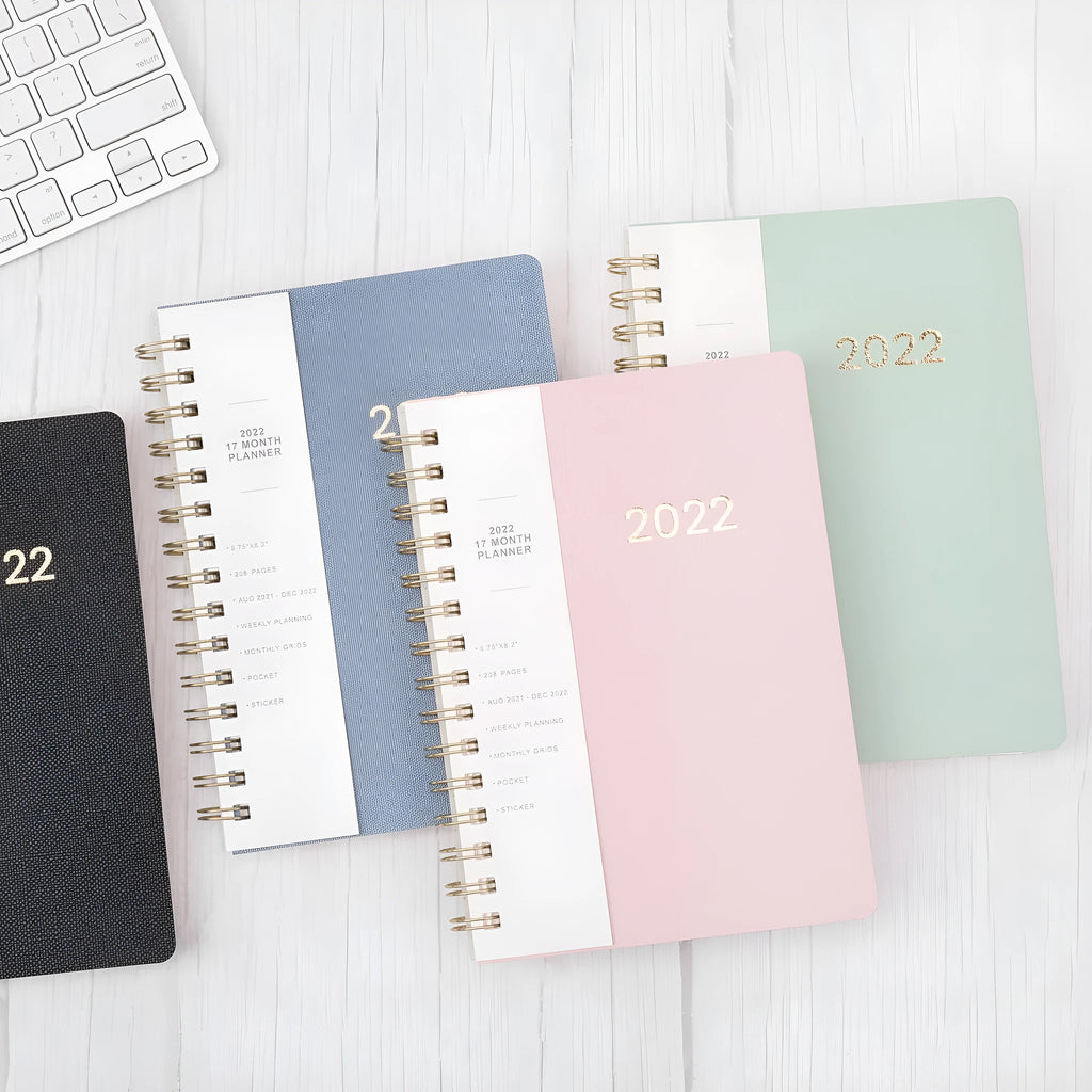 Blue or green PU leather student planner with weekly calendar pages and interior pockets