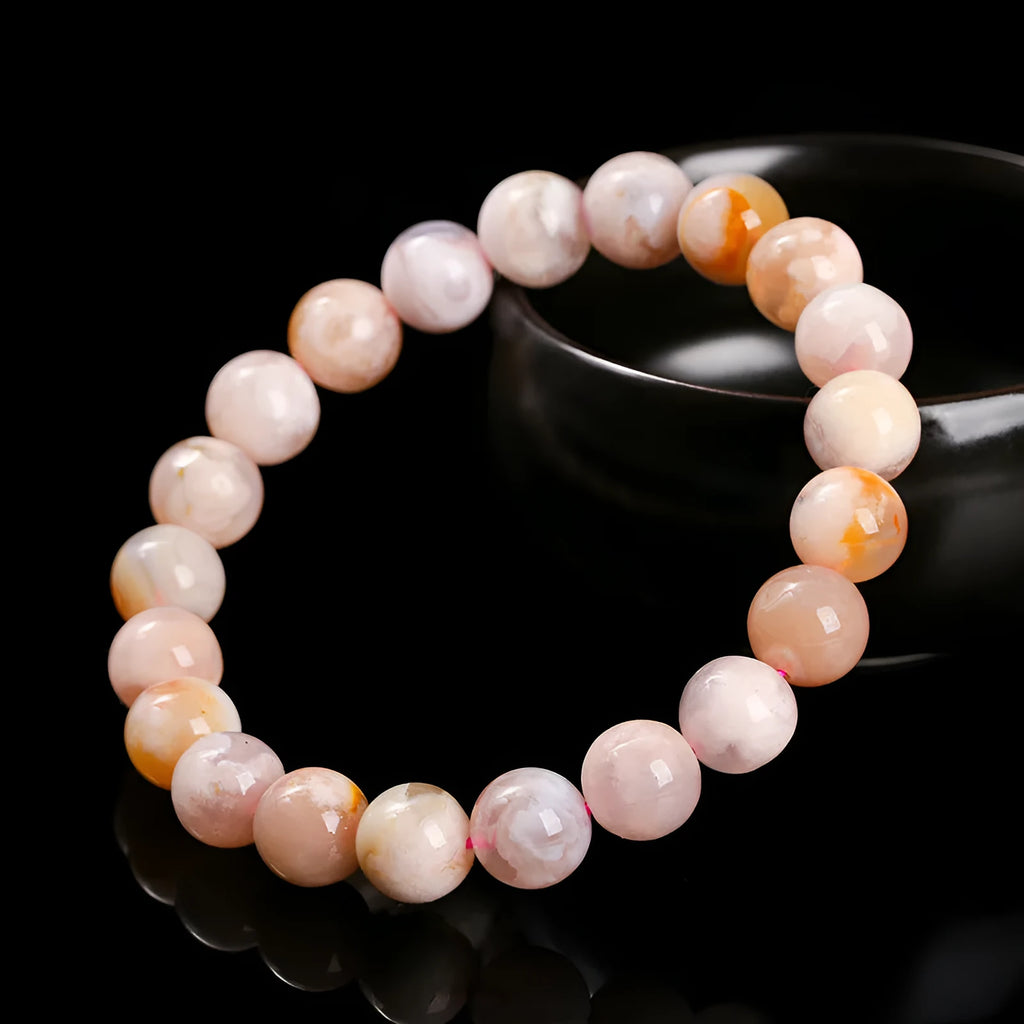 Natural cherry agate bracelet with round geometric beads in a sweet style for women.