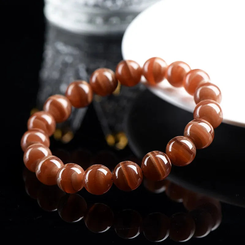 Natural old mine rhodochrosite round beads bracelet from Peru showing 6mm or 8mm geometry beads with Ruyi elements