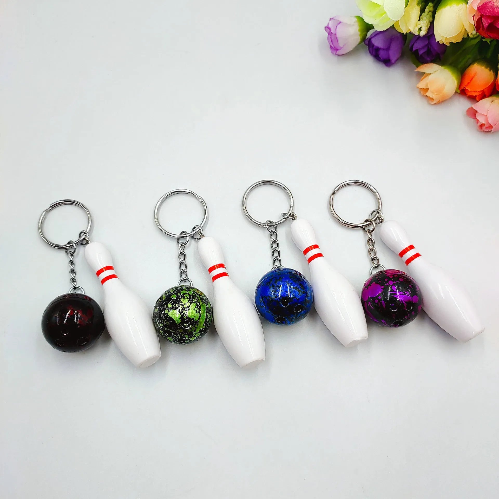 Mini bowling ball keychain pendant in dark red, blue, purple, or green colours