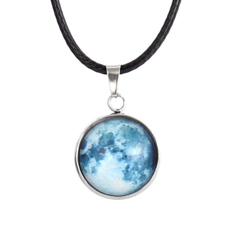 Close-up of a constellation design glass pendant on an alloy chain necklace with extension.