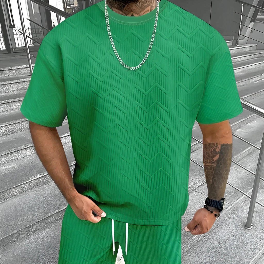 Men's blue short sleeve shorts leisure suit on a hanger, showing the top and pants.