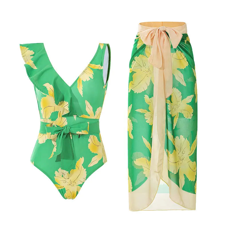 Solid colour women's one-piece swimsuit with thin spaghetti straps and a removable wrap skirt.