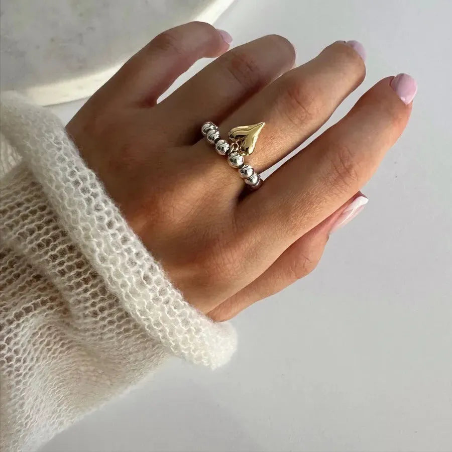 Handmade elastic love ring with geometric heart charm on beaded string