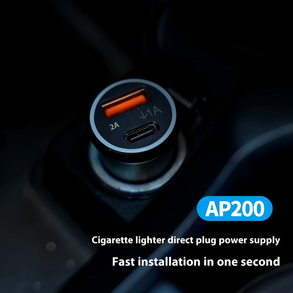 Black GPS car locator tracker with car charger on a table