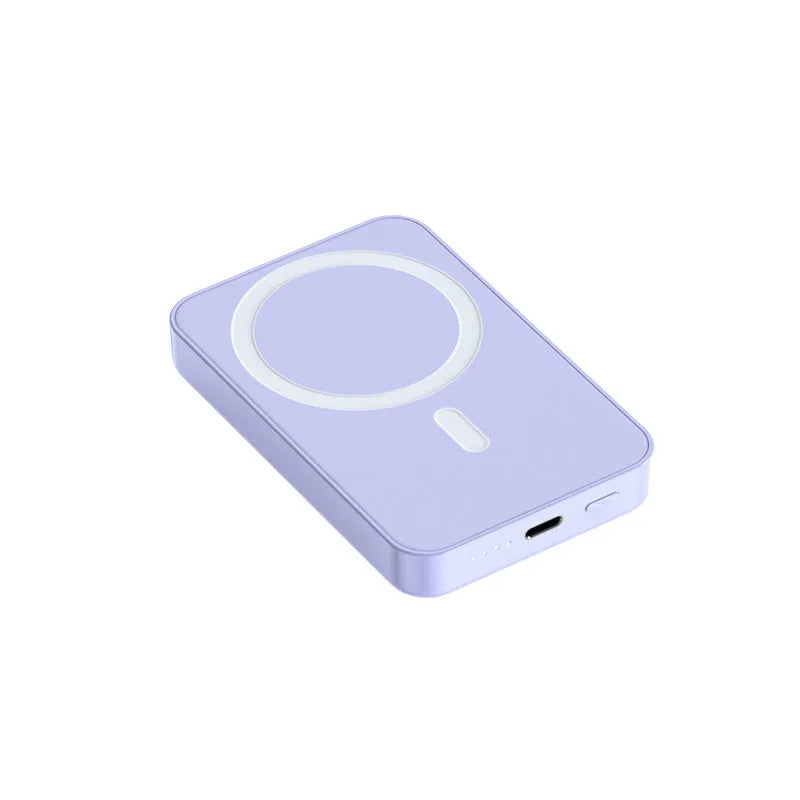 Pink magnetic wireless power bank showing 20000mAh capacity and 20W output on a table.