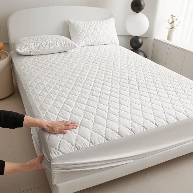 Diamond lattice quilted waterproof mattress protector fitted sheet set in solid colour.