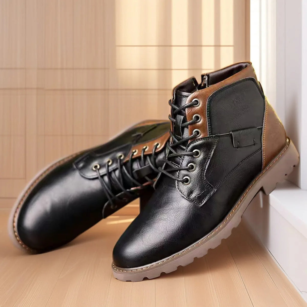 Brown men's ankle boot with a side zip, round toe, and rubber sole on a plain background.