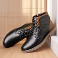 Brown men's ankle boot with a side zip, round toe, and rubber sole on a plain background.