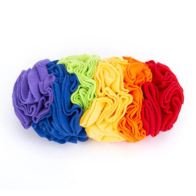 Dog snuffle pad made of polar fleece fabric in rainbow colour, 25x15cm, lying flat on floor