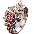 Adjustable butterfly ring necklace with colourful dripping oil finish showing floral and insect detailing
