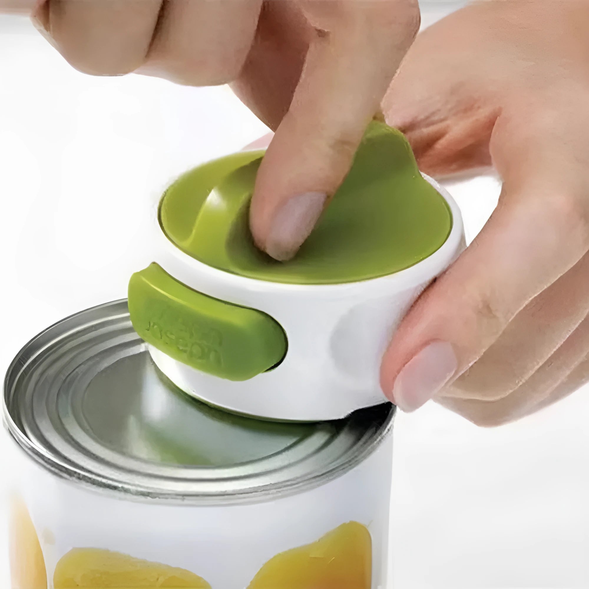 Green and red stainless steel lid opener tool for jars and bottles, 6.7 cm long.