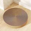 Round green cat scratching board with corrugated cardboard surface measuring 55 cm across