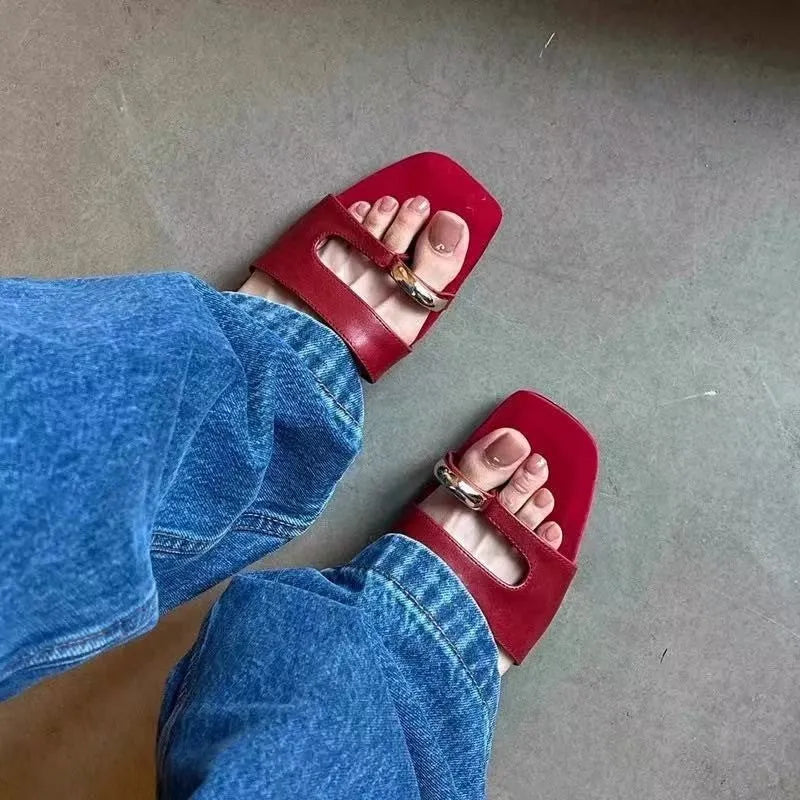 Plus size leather outdoor slippers with square toe in red, white, black, and silver on a rubber sole.