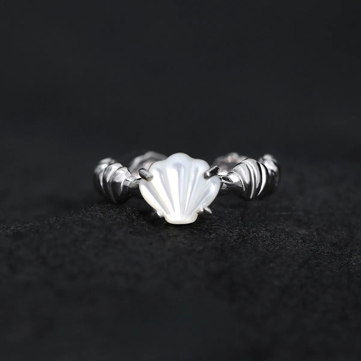 Women's adjustable silver ring with a shell tiger eye stone and white gold electroplating.