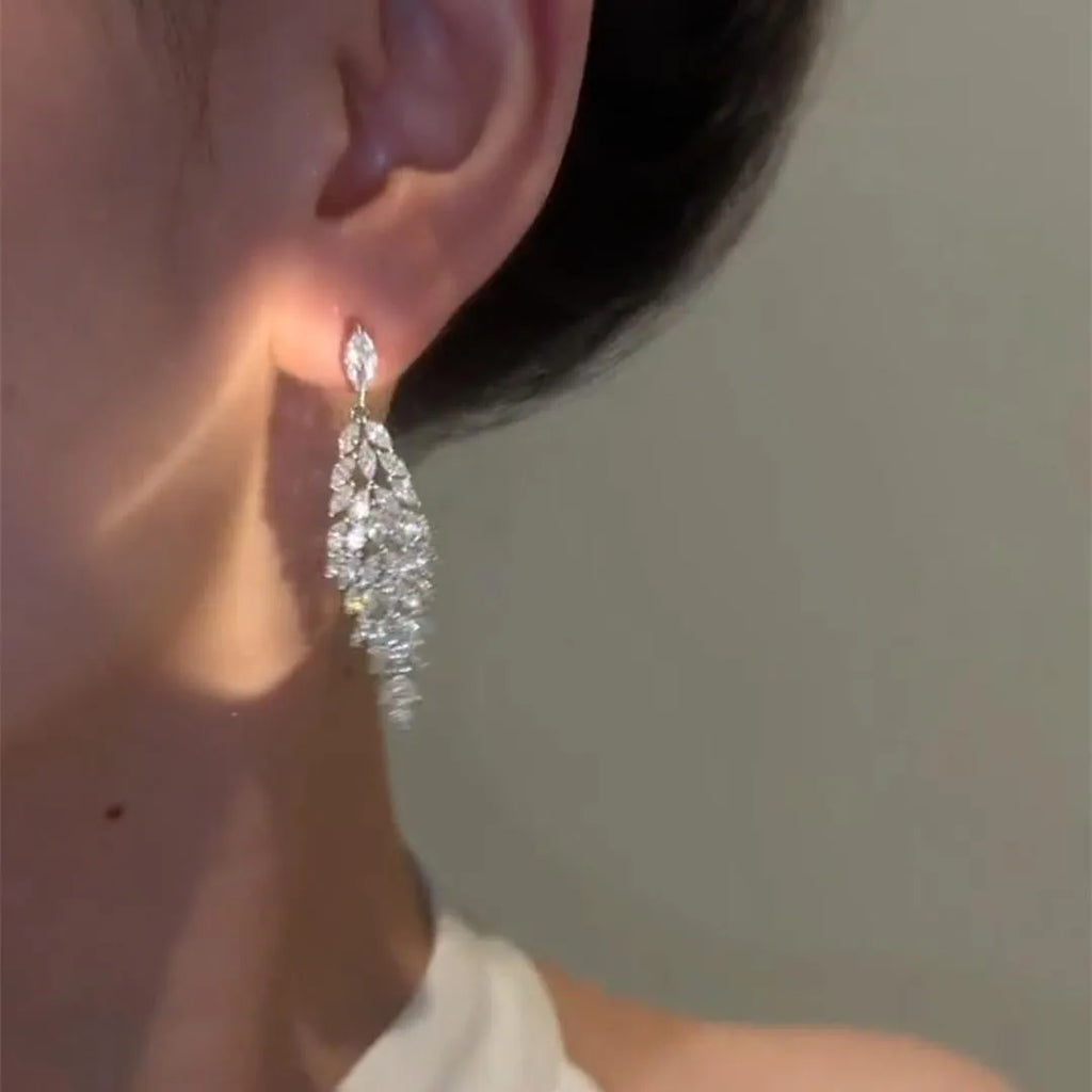 Silver anti-allergy auricular needle earrings with Japanese Korean style New Year design on alloy base