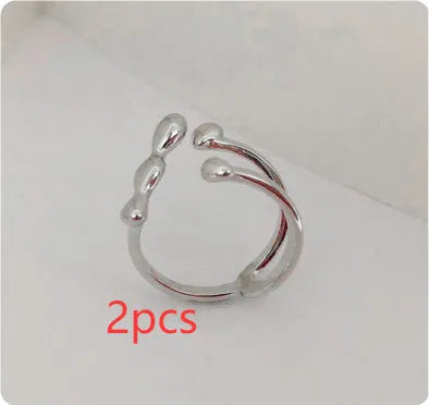 Brass spherical ring with circular design elements in gold or silver finish