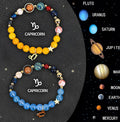 Two natural stone beaded bracelets for zodiac signs on a textured background.