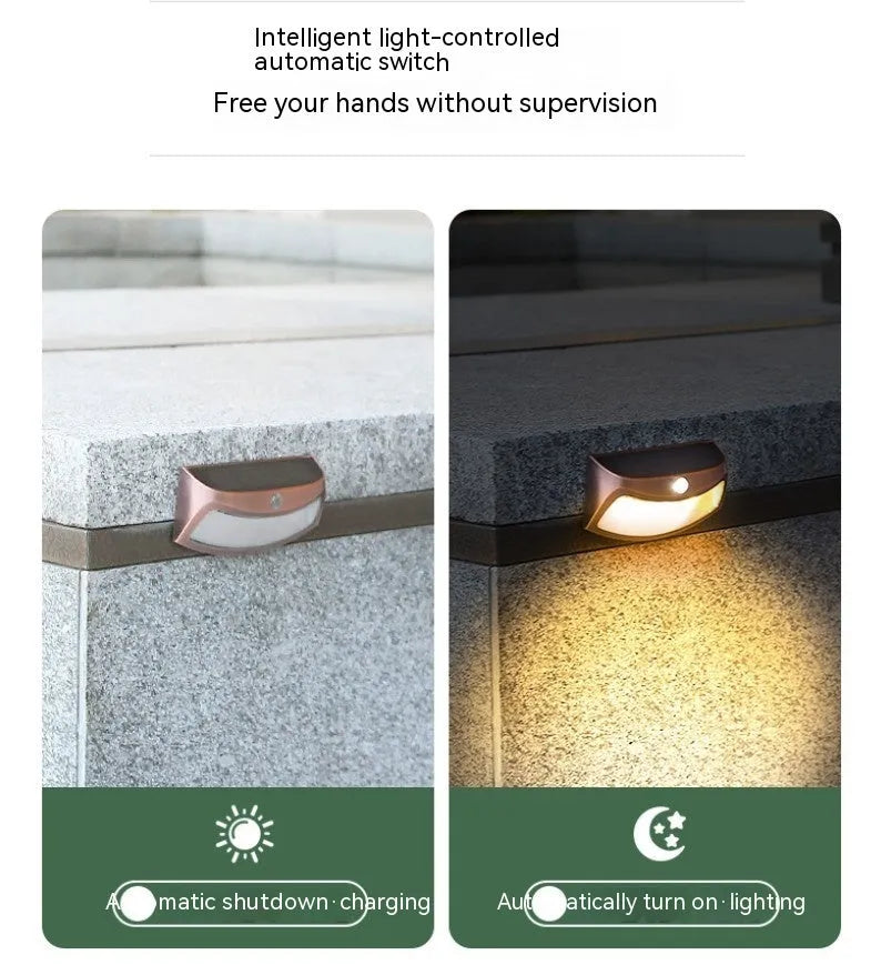 Solar outdoor wall lamp with smiling face design measuring 153mm wide
