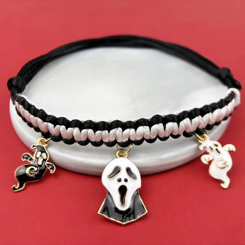 Halloween pet collar with zinc alloy charm showing pumpkin bat design on adjustable black webbing