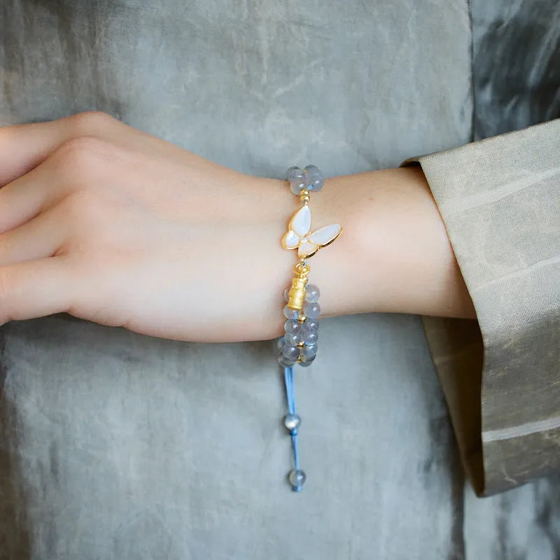 Handwoven women's bracelet with grey moonstone butterfly centrepiece on geometric design