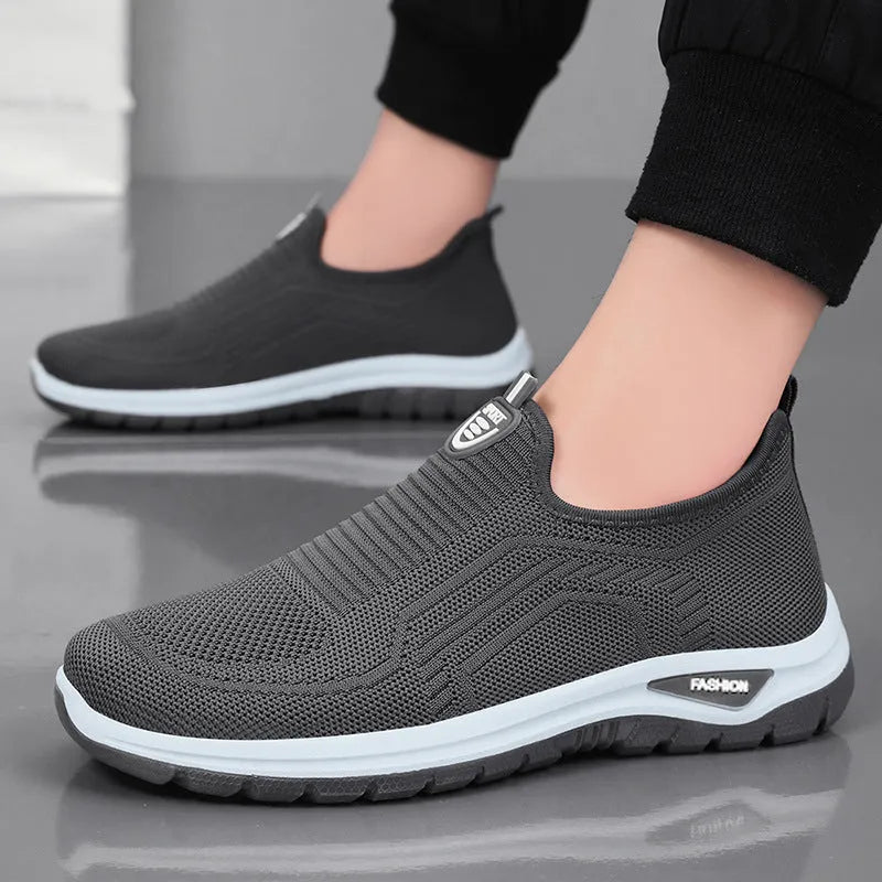 Men's black and grey breathable casual shoes with mesh lining and flat sole.