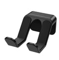Universal black plastic hanging rack for game controllers mounted on a wall with adhesive.