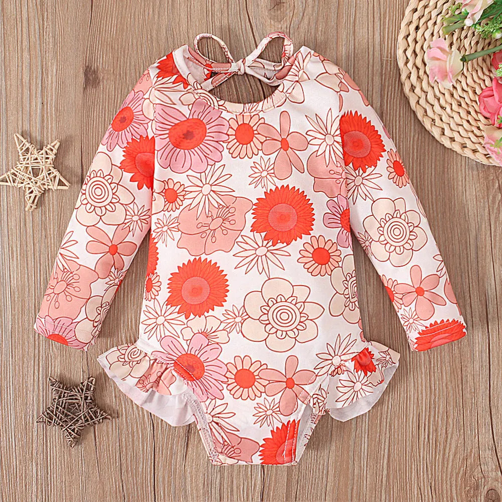 Girl's floral pattern open back swimsuit in orange red, available in sizes 70 to 110 yards.
