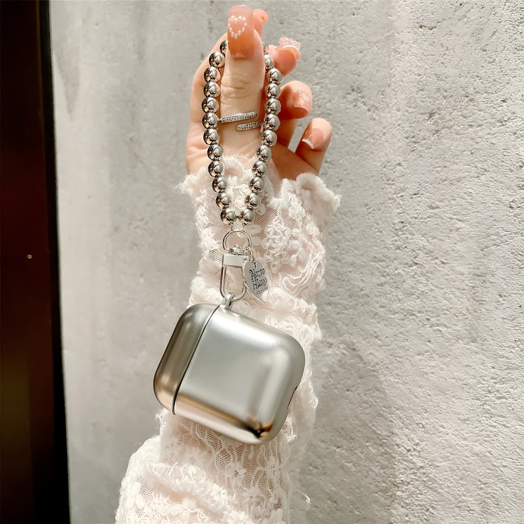 Matte plating TPU protective cover for Apple AirPods with an integrated carrying bracelet attached.