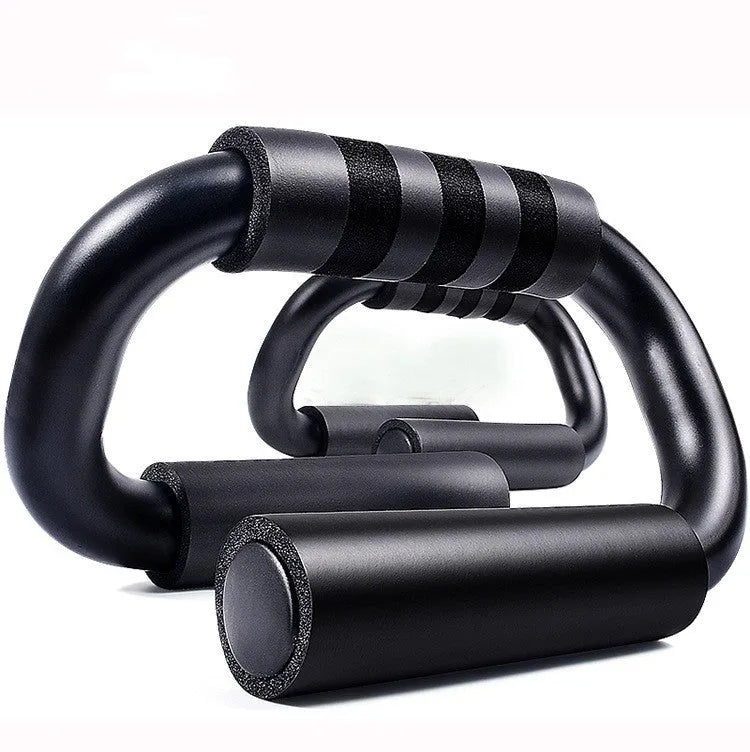 Black S shape push-up bracket rack on a home gym floor