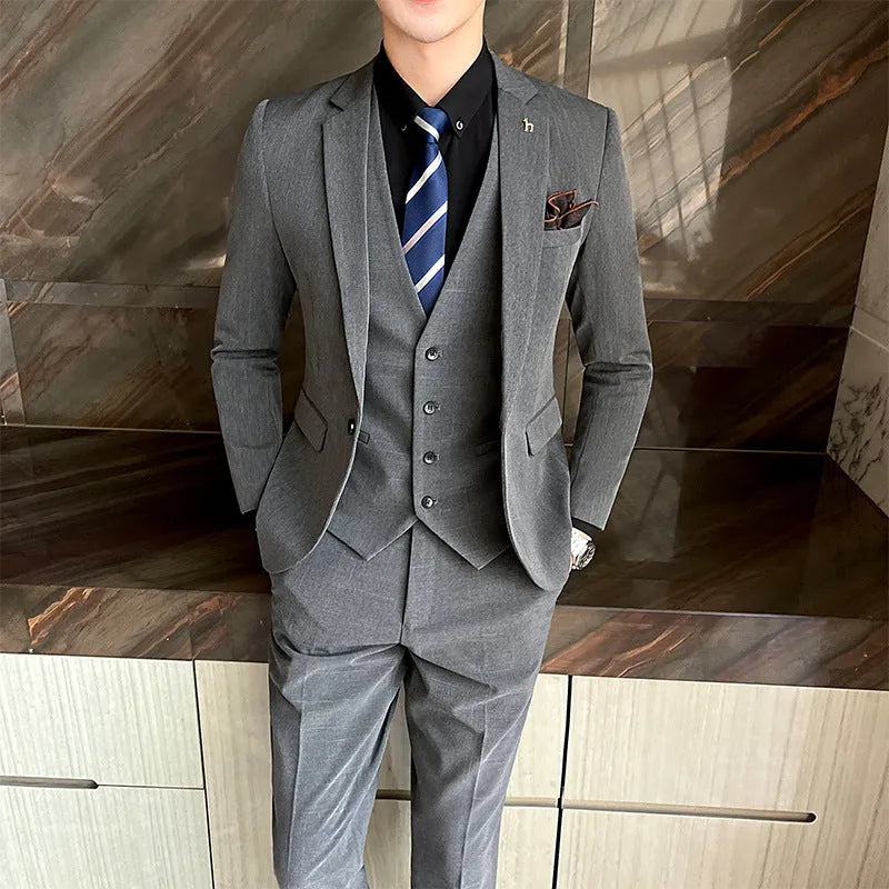Men's slim fit suit in black and dark grey, cotton blend fabric, business formal wear set.