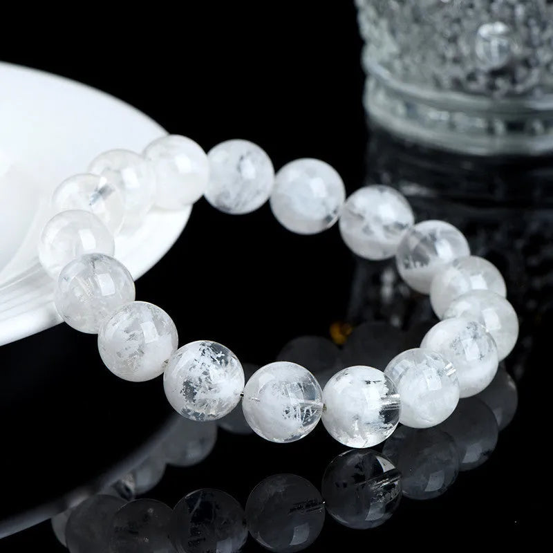 Women's crystal bracelet with blizzard snowflake round beads and Ruyi design in geometric shape.